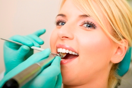 happy female patient at the dentist